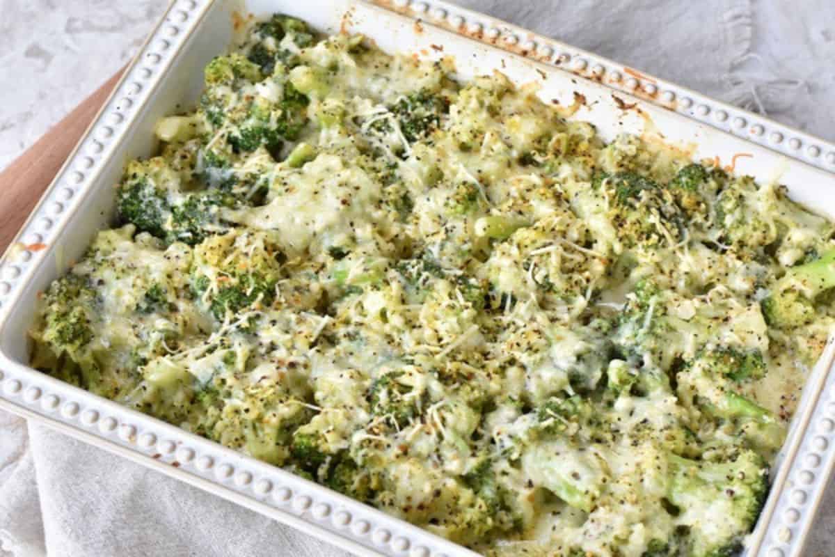 A casserole dish filled with broccoli and cheese.