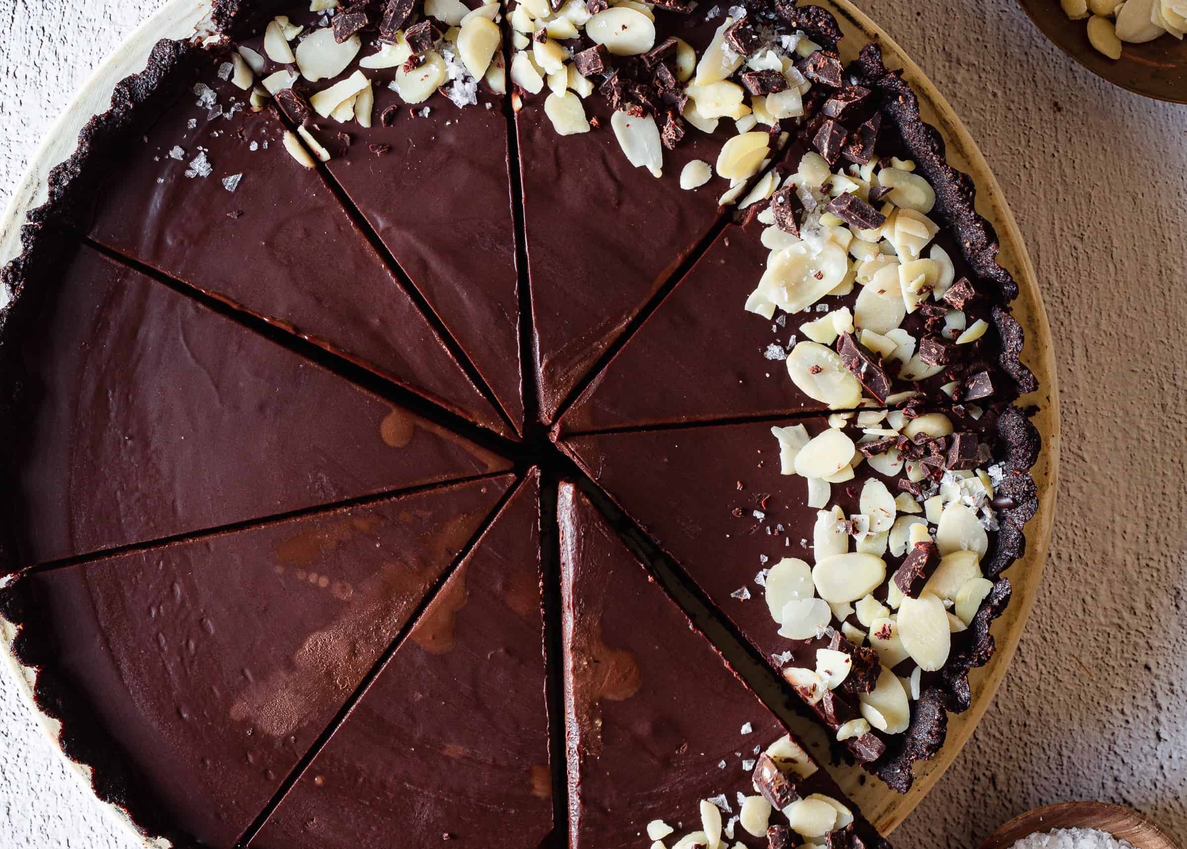 Chocolate tart sliced into pieces.