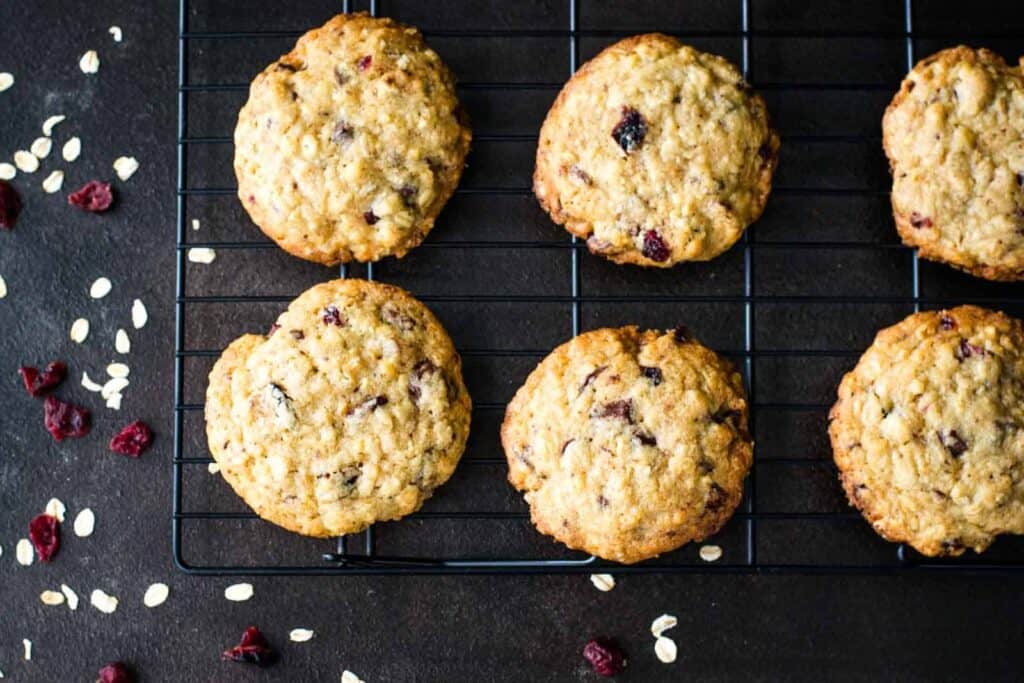 Cranberry oatmeal cookies on a cooling rack.