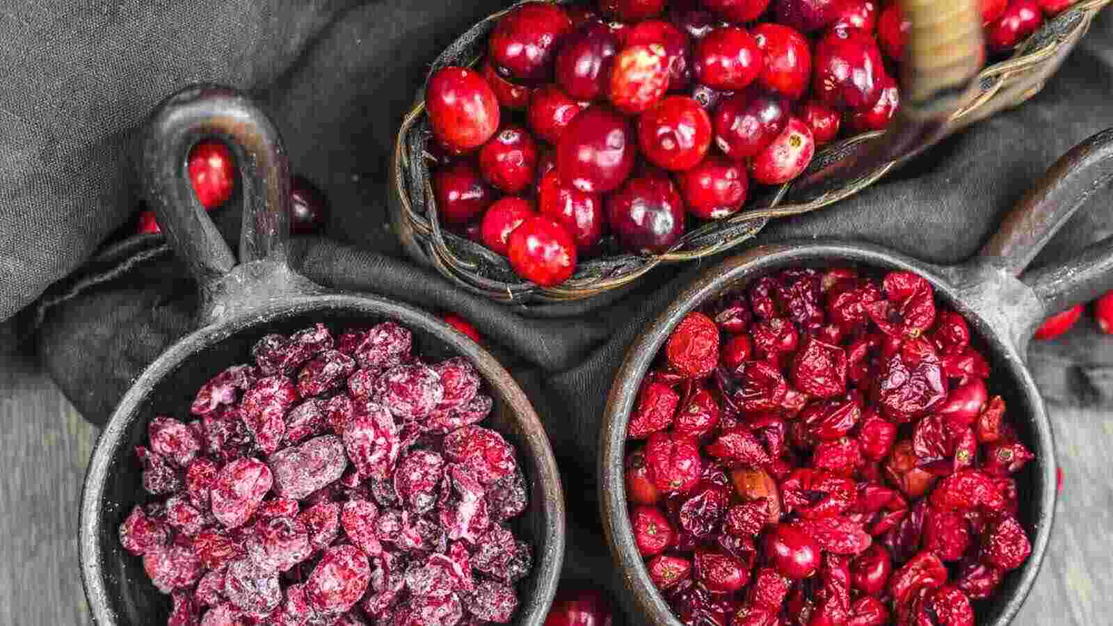 Cranberries in bowls on a table.