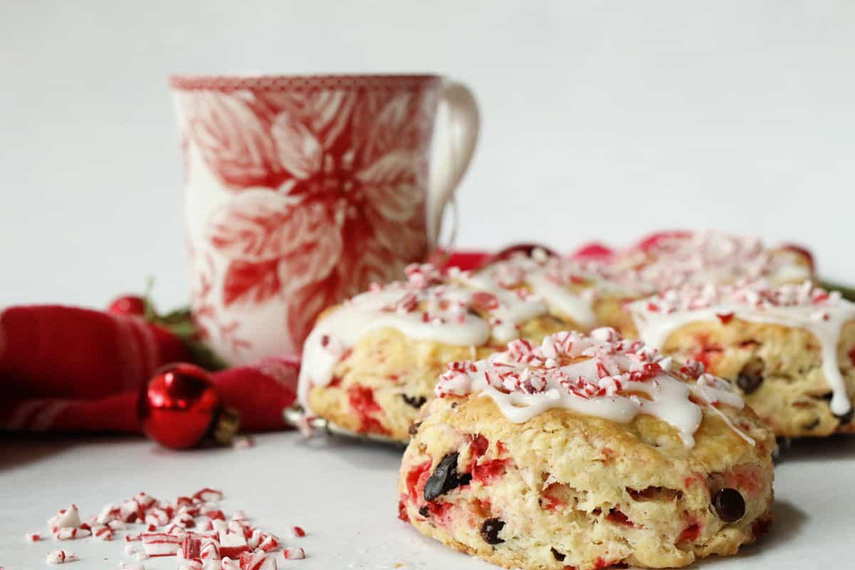 Chocolate and peppermint scones with icing and peppermint candies.