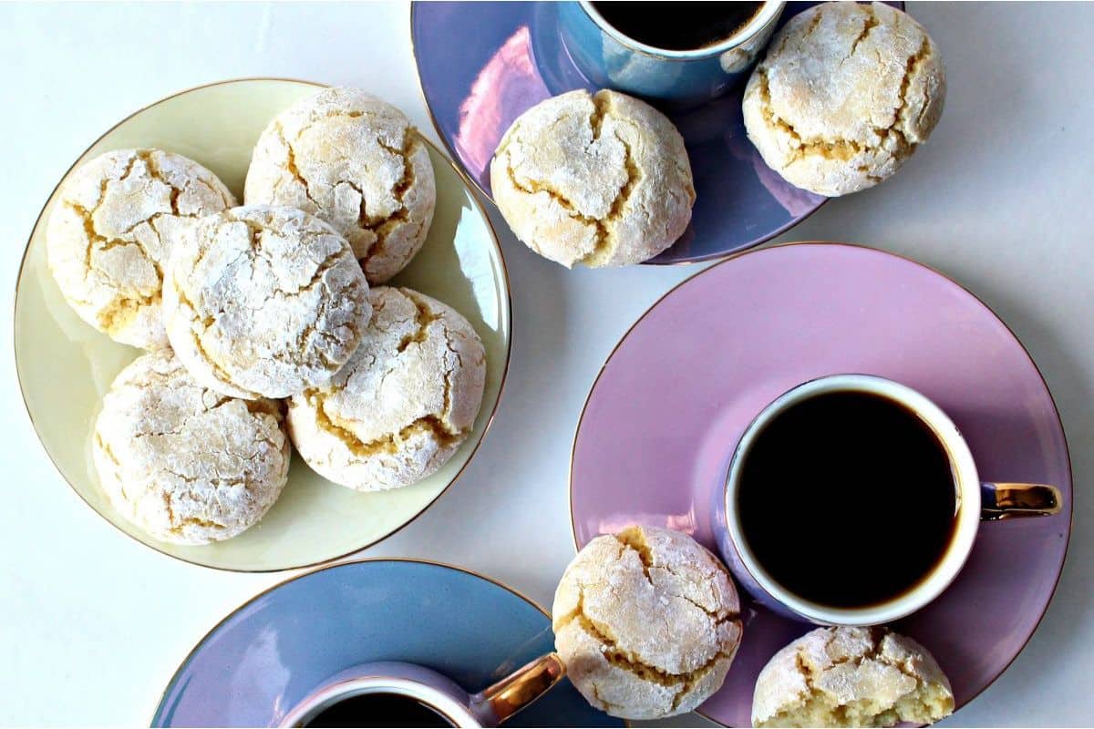 A plate of cookies and a cup of coffee.