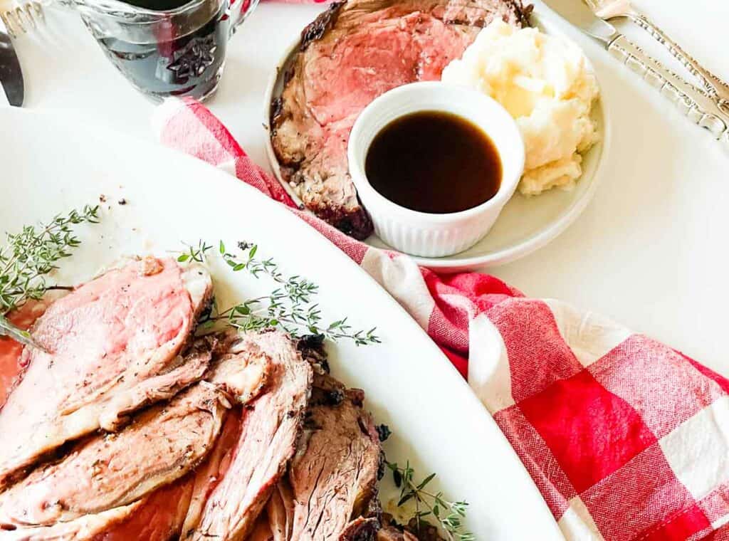 A plate of roast beef with gravy and mashed potatoes.