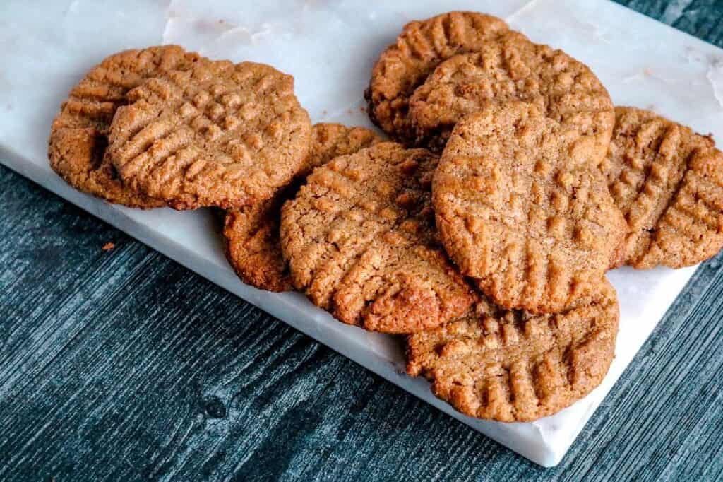 Almond butter cookies on a marble plate.
