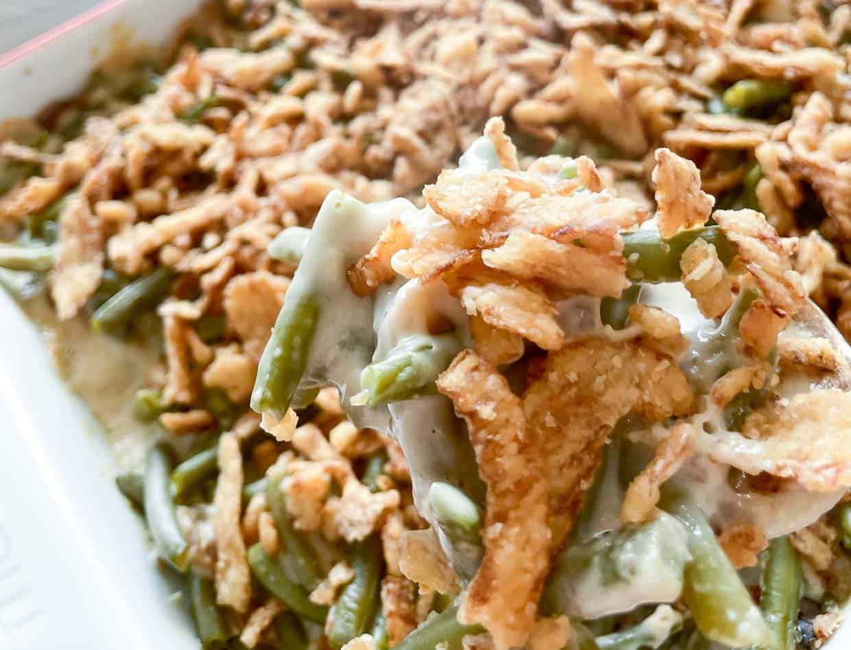 Green bean casserole topped with crispy onions.