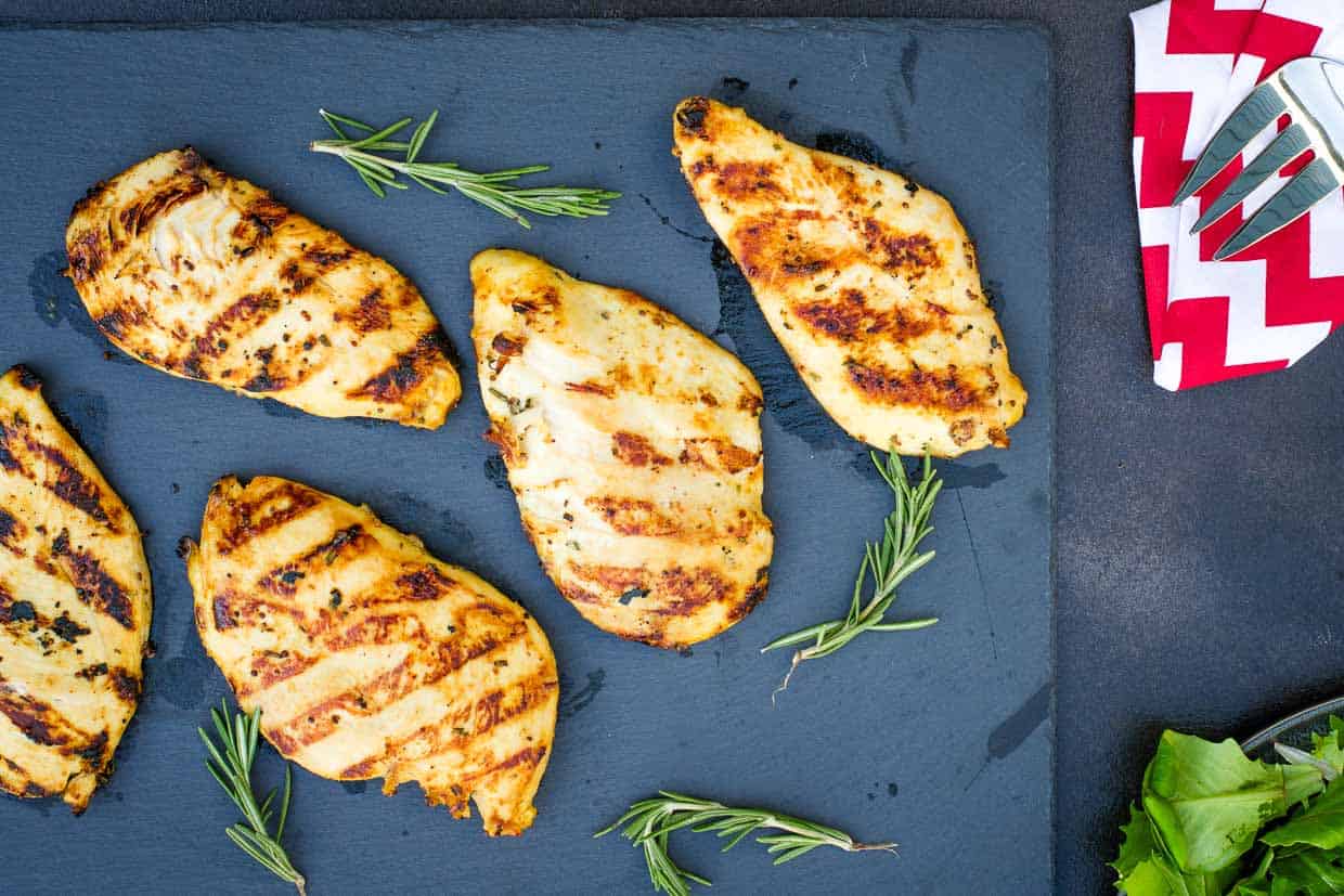 Easy chicken recipes: Grilled chicken breasts on a slate board.