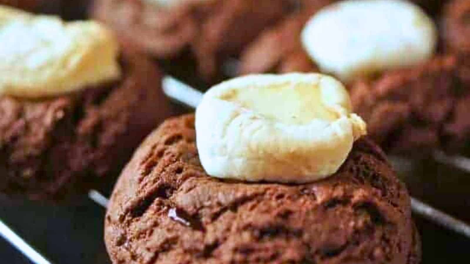 Image shows hot chocolate cookies cooling on a rack.