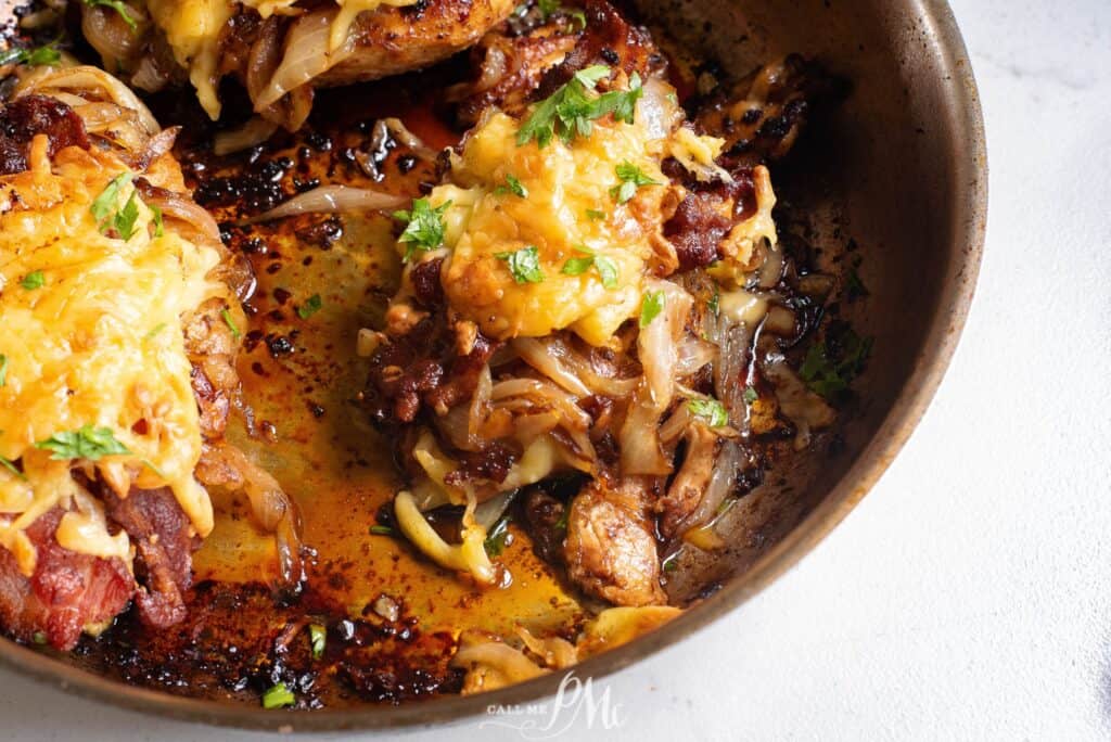 Easy chicken recipes: Chicken breasts in a skillet with onions and cheese.