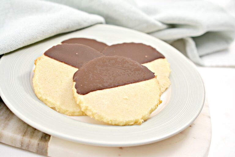 A white plate with cookies on it.