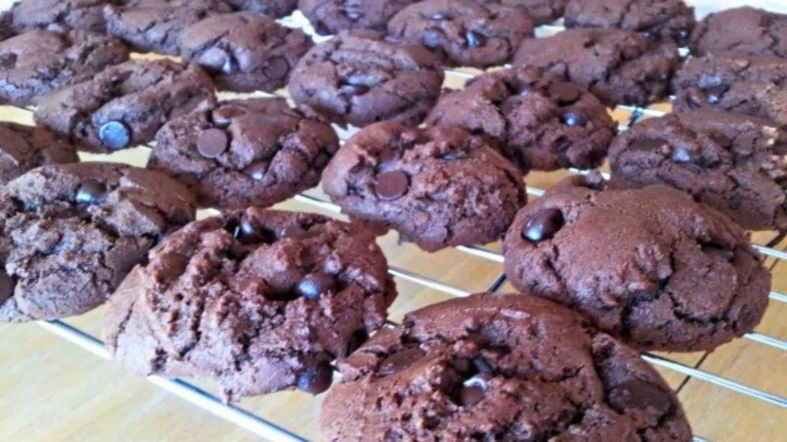 Image shows Mexican triple chocolate cookies cooling on a wire rack.