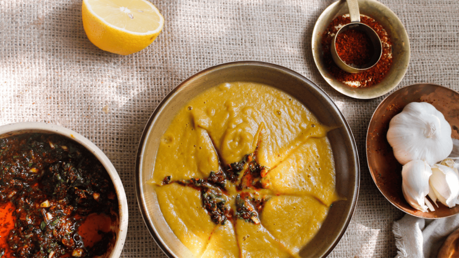 Two bowls of soup on a table.