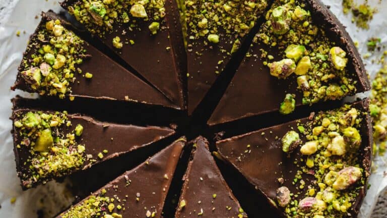 Chocolate pistachio tart with pistachios is a delectable pastry that combines the rich flavors of chocolate and pistachios. The tart is beautifully crafted with a decadent chocolate filling and garn
