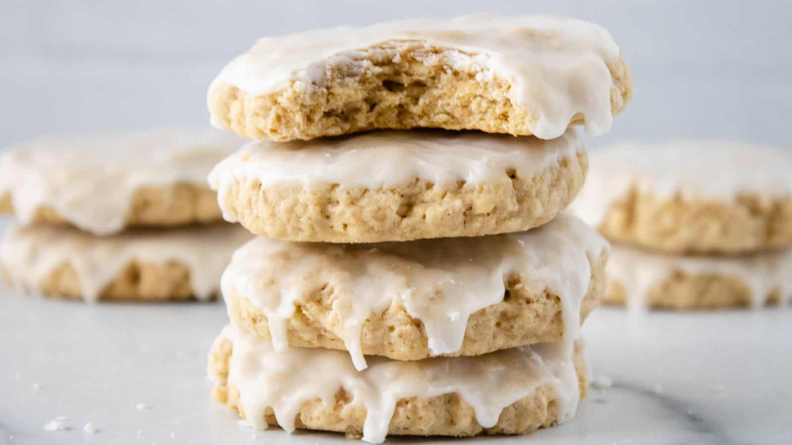 A stack of iced oatmeal cookies.