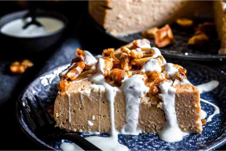 A slice of chocolate walnut cheesecake on a plate.