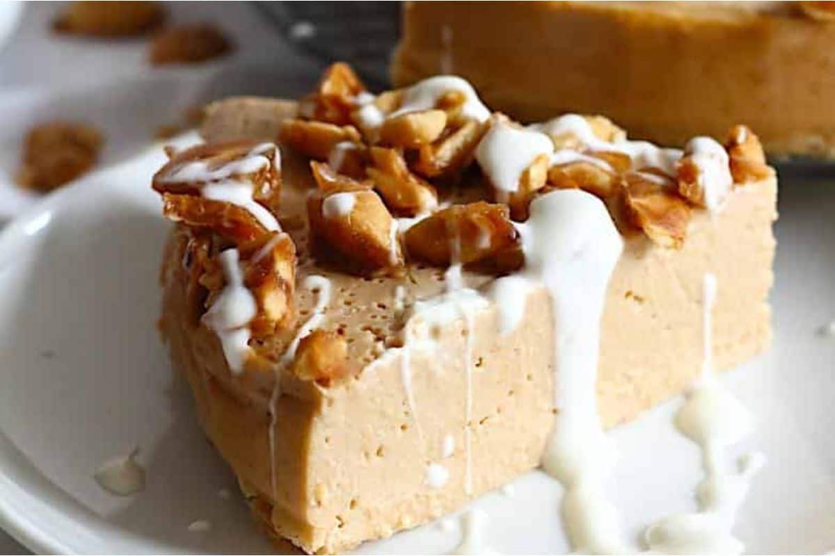 A slice of peanut butter cheesecake on a plate.