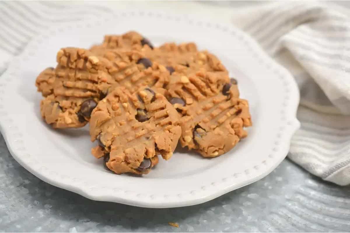 Peanut butter cookies on a white plate.