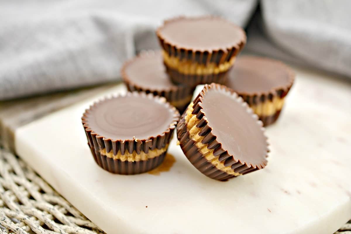 Peanut butter cups on a white plate.