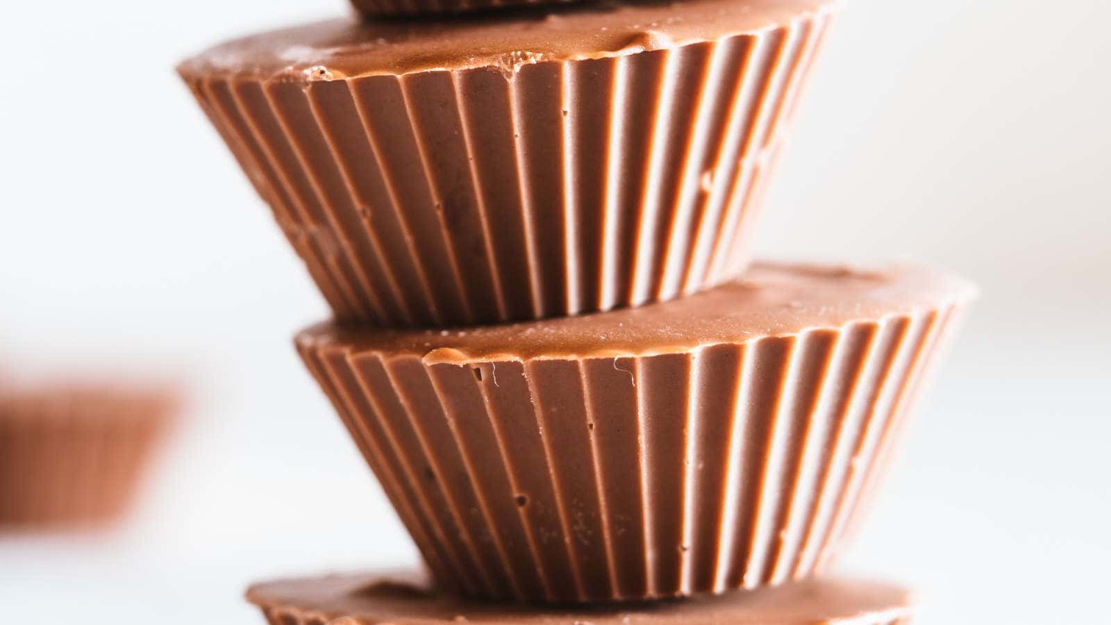 Close up of a stack of peanut butter cups with blurred background.
