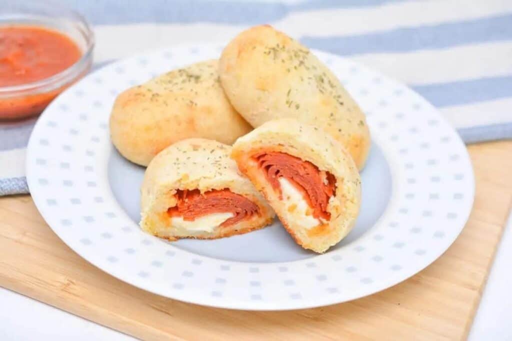 Pepperoni rolls on a plate.
