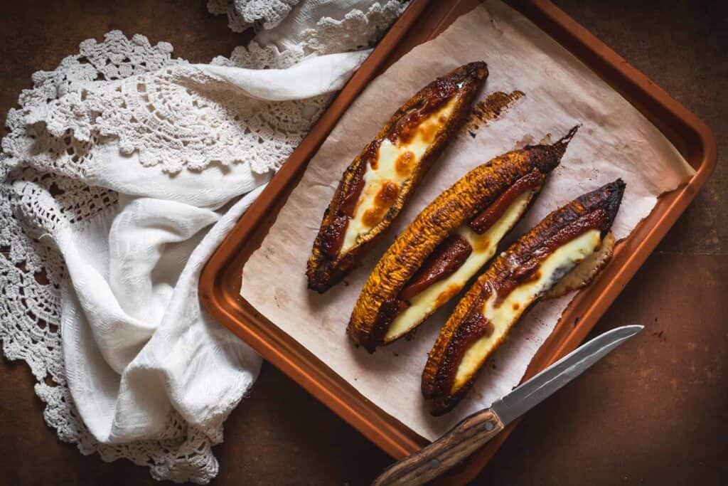 Baked plantains with cheese and guava wth tablecloth.