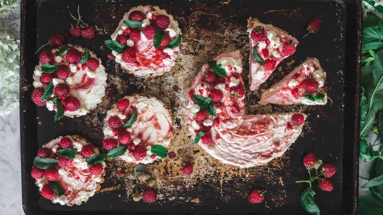 Overhead of sliced raspberry cheesecake.