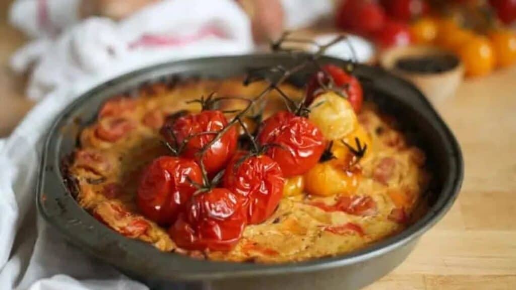 Vegan quiche in baking dish with towel.