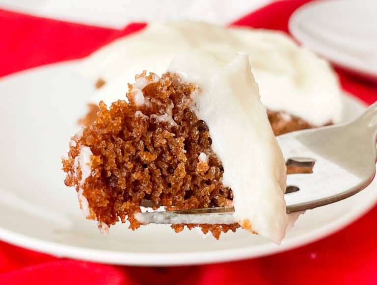 A piece of carrot cake on a fork.