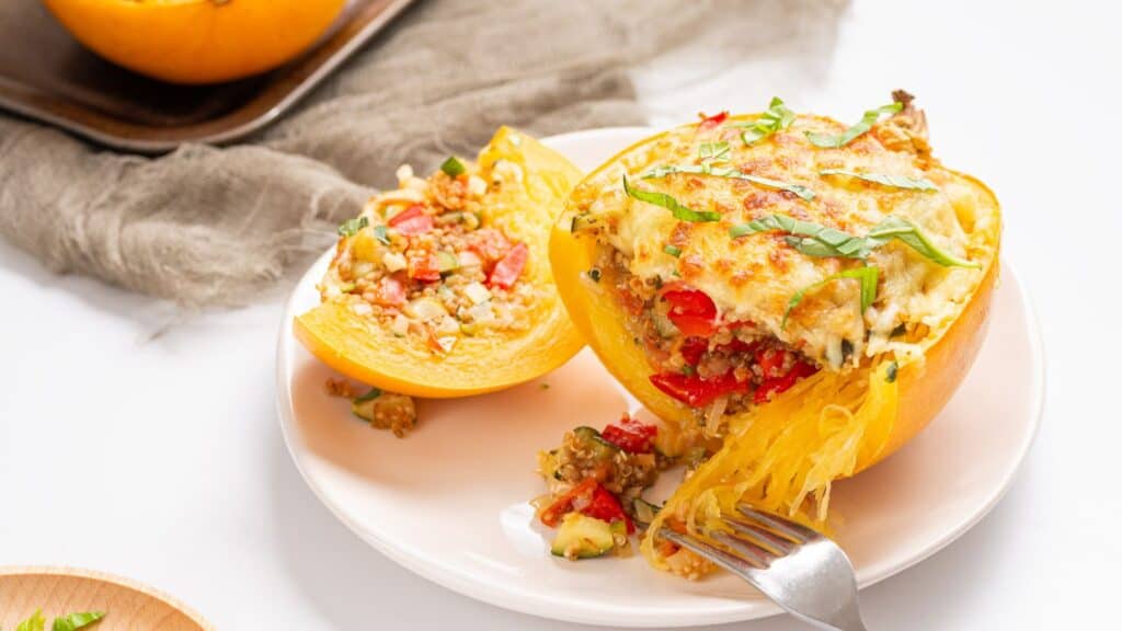 Stuffed squash on a plate with a fork.