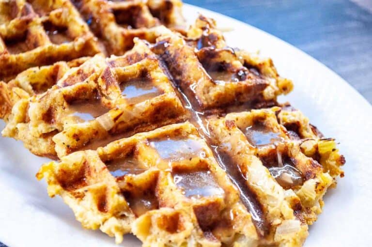 A plate of waffles on a white plate.