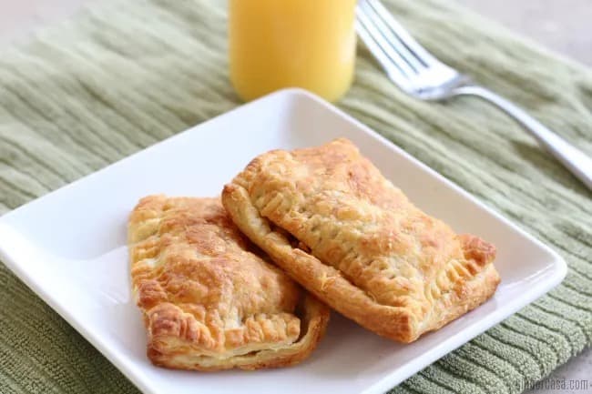 Photo of air fryer breakfast pockets on a white plate.