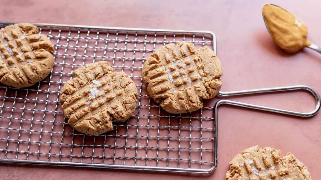 Gluten free peanut butter cookies on a cooling rack.