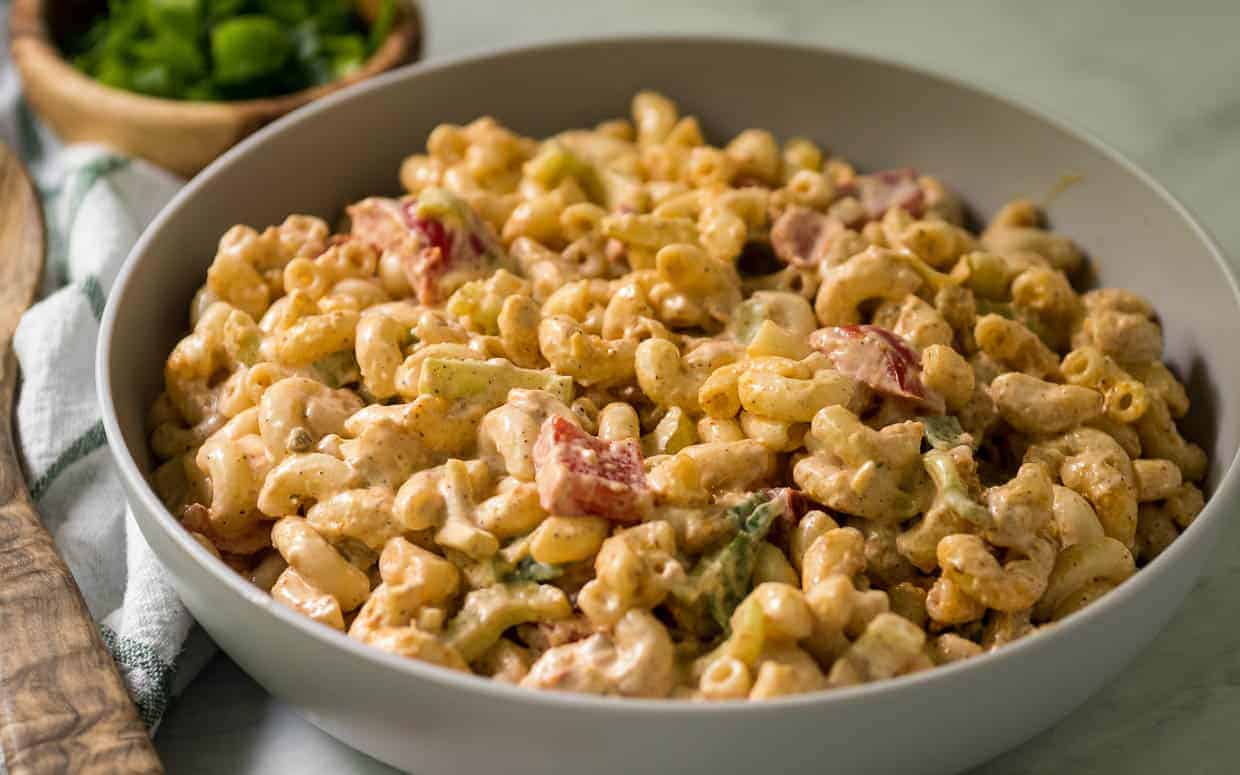 Cajun pasta salad of noodles with celery and bell pepper.