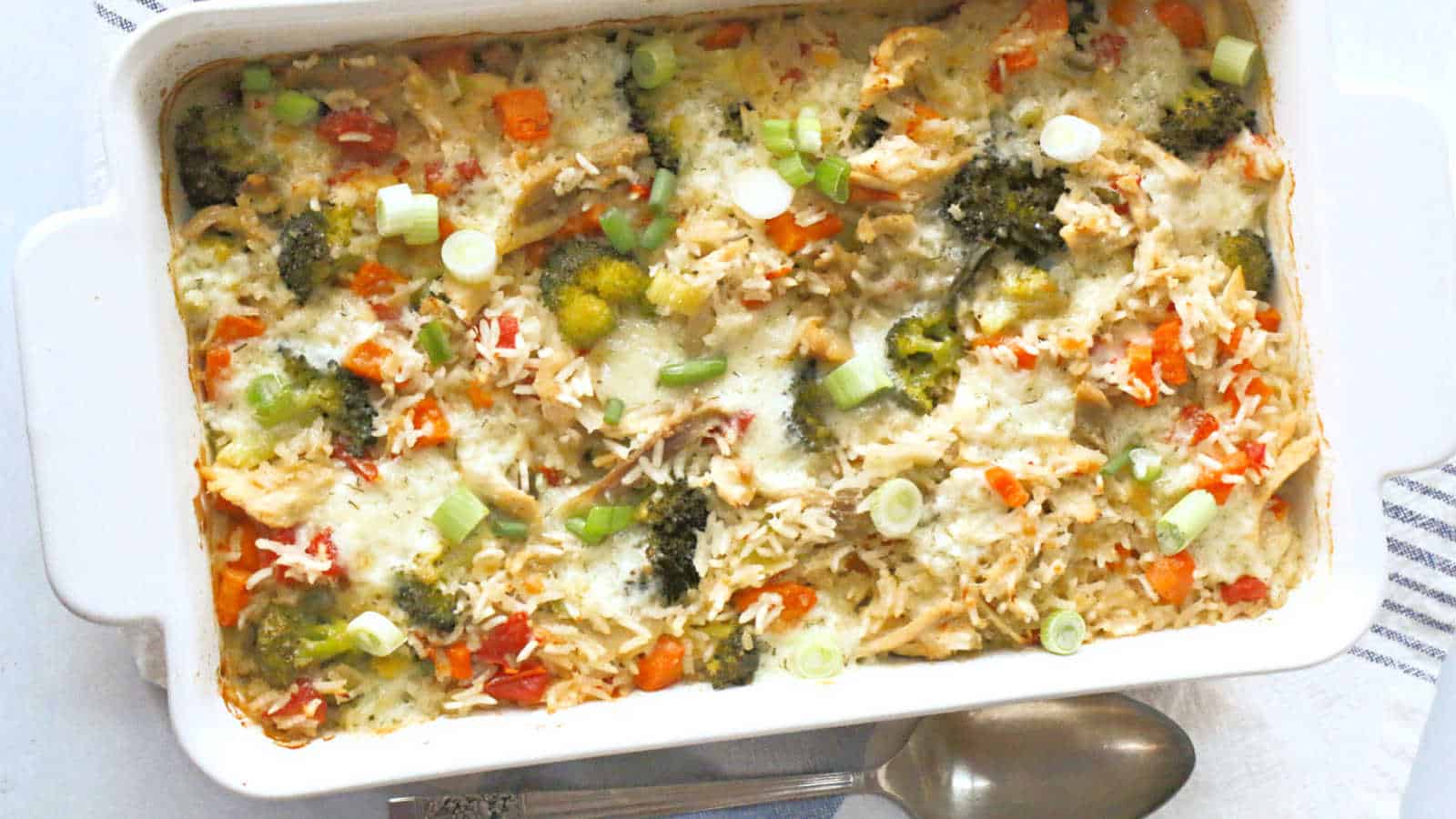 A casserole dish filled with vegetables and cheese.