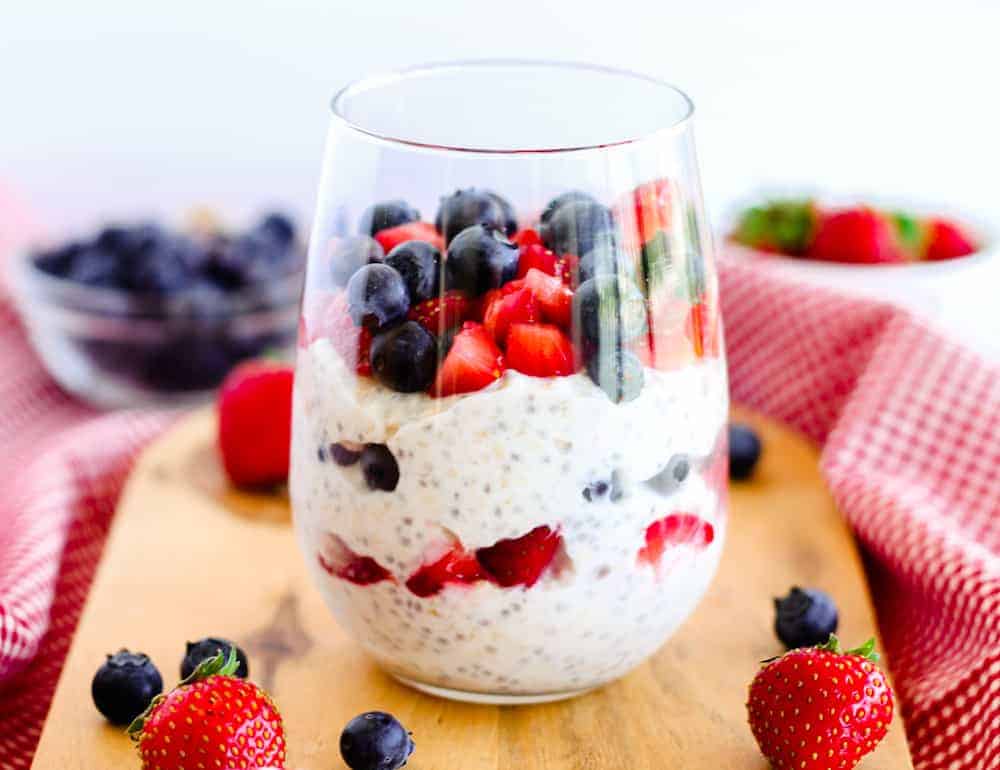 Chia Overnight Oats in a glass with fresh berries.