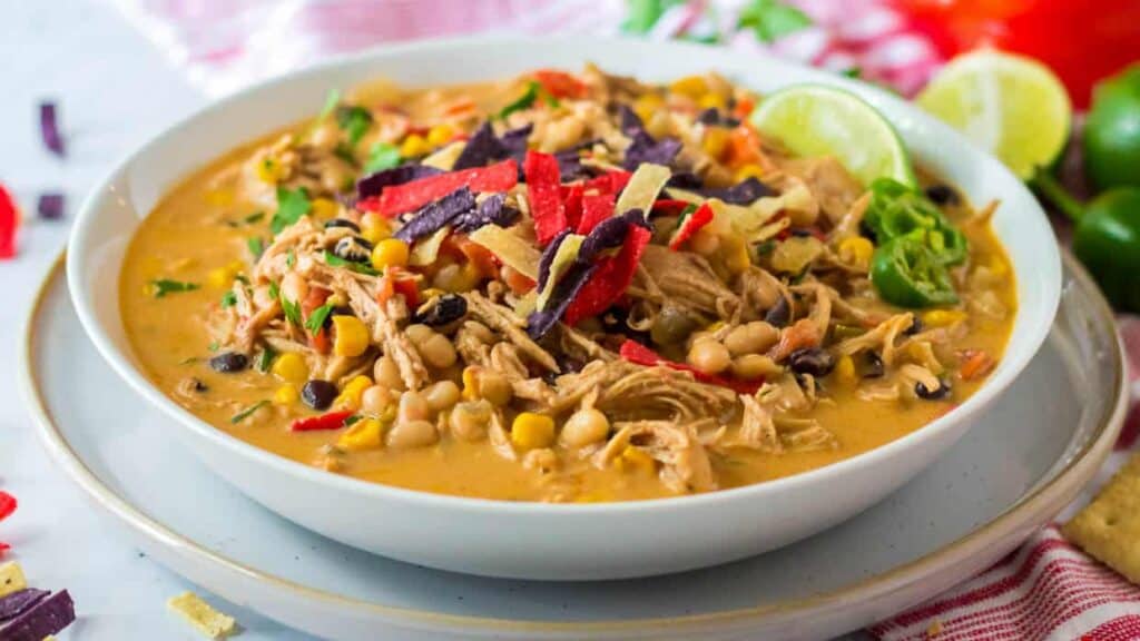 Mexican chicken soup in a white bowl.