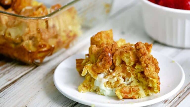 A plate with a piece of bread pudding on it.