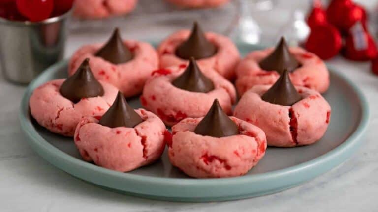 Valentine's day cookies with chocolate kisses on a plate.