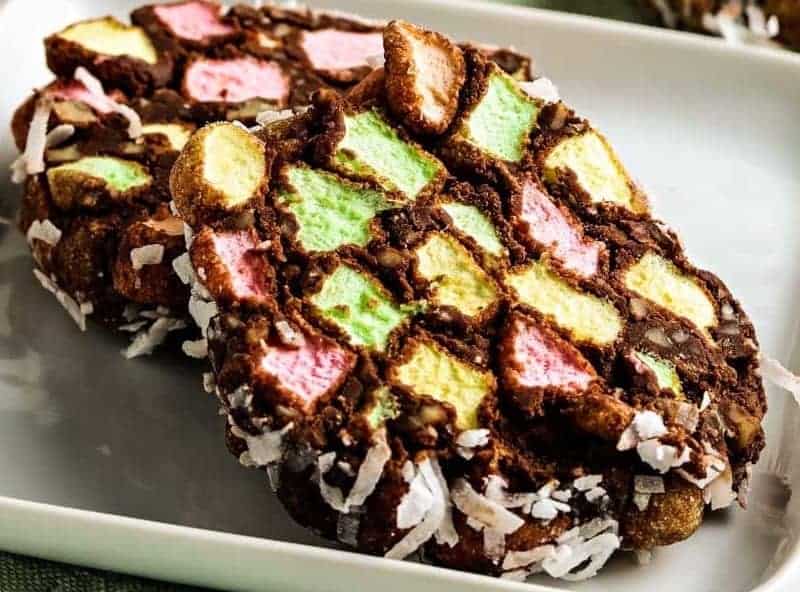 A plate of cookies with colorful sprinkles on it.