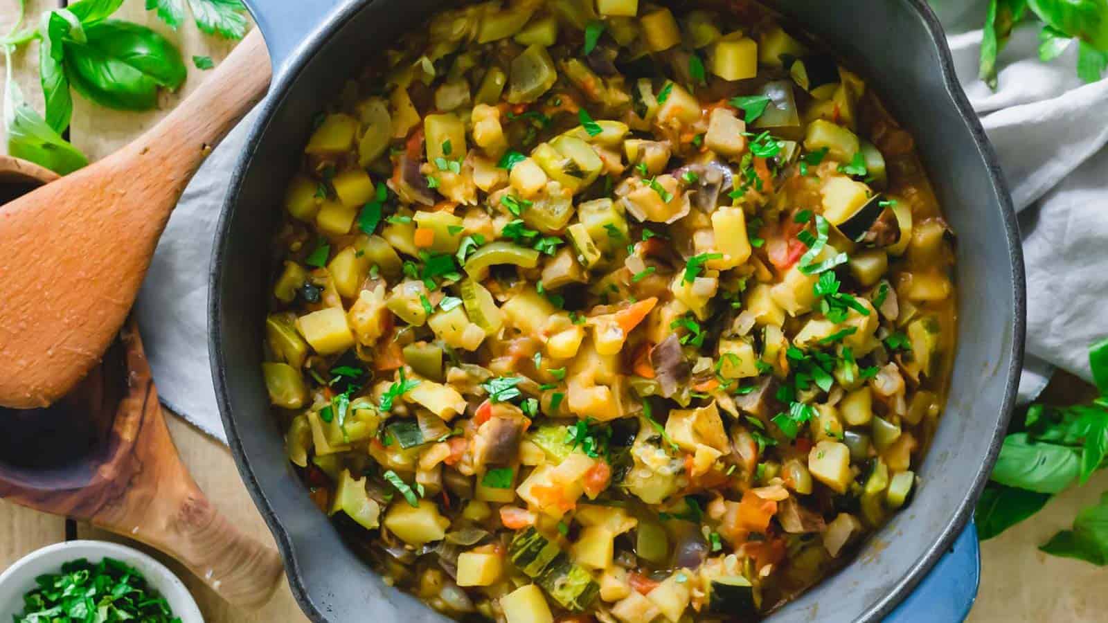 Italian ciambotta (vegetable ratatouille) in a large cast iron pot.