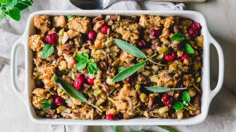 A dish of stuffing with cranberries and sage.