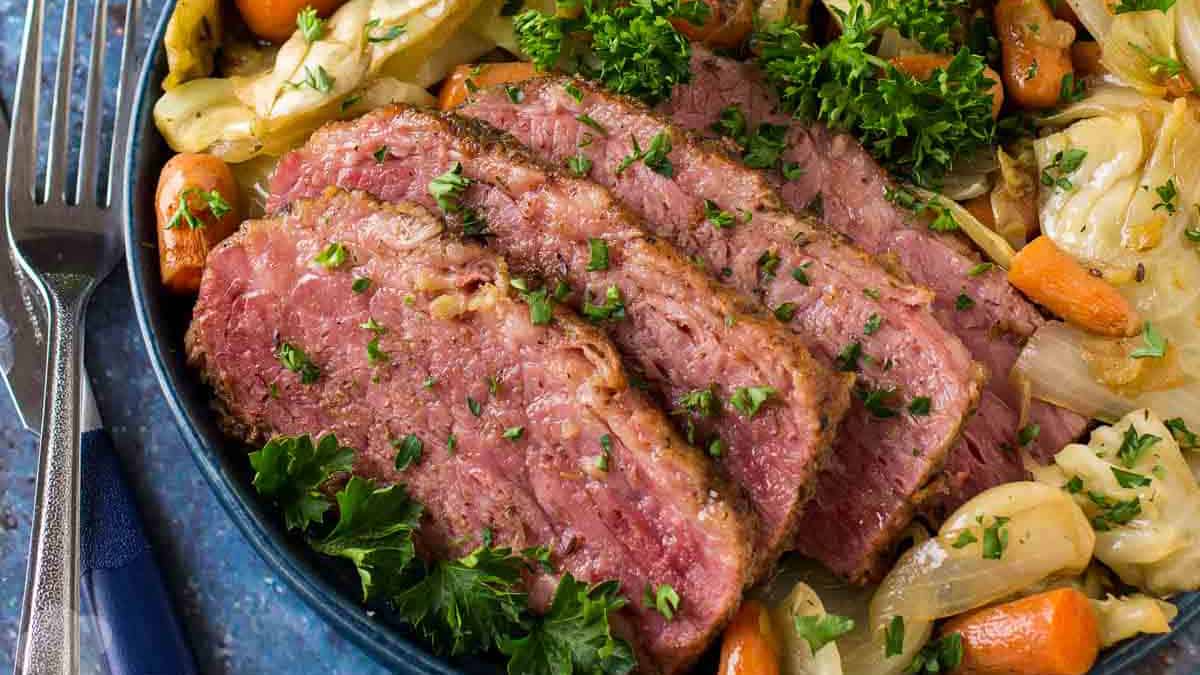 Front view of a plate with Irish Braised corn beef and cabbage.