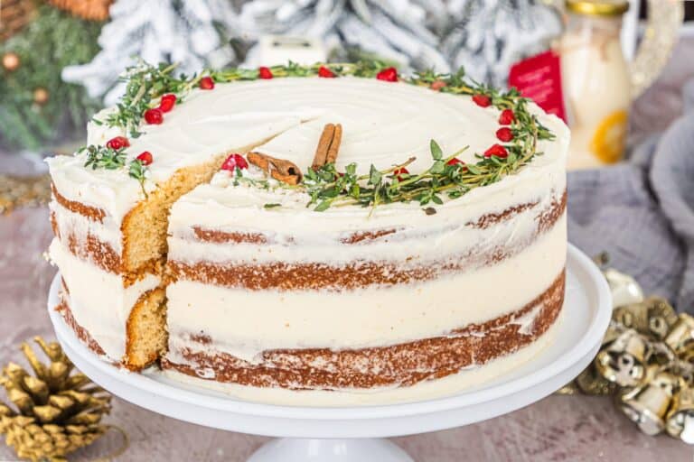 A christmas cake with a slice taken out of it.