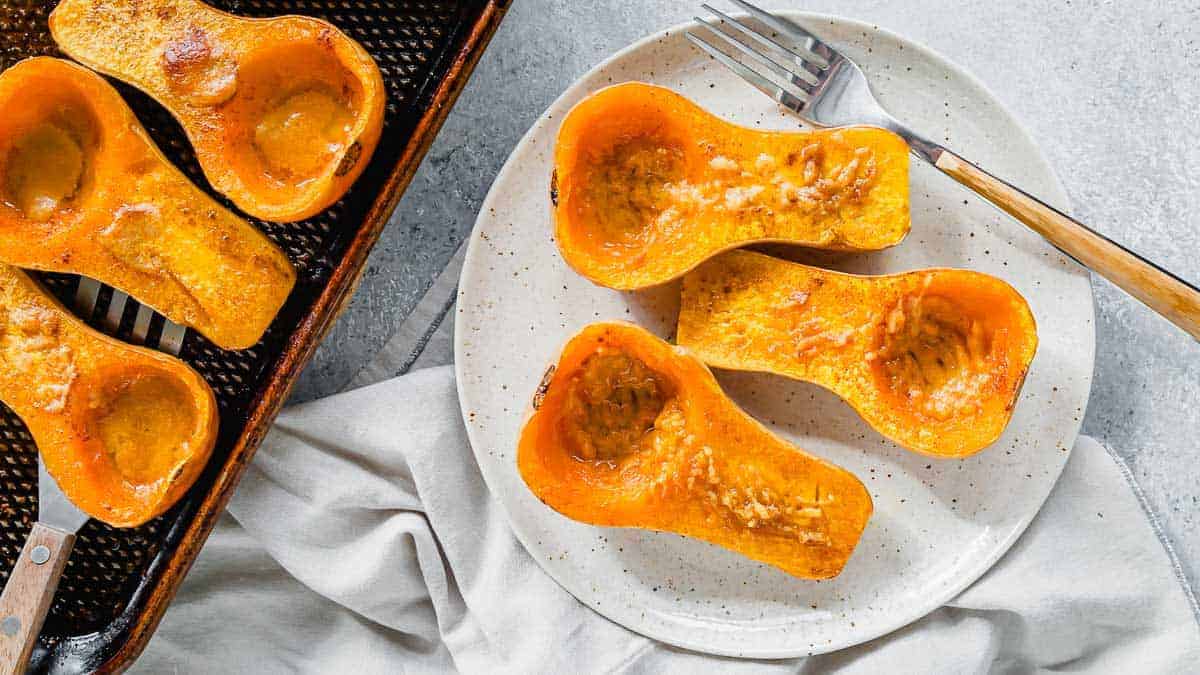 Roasted honey patch squash on a plate with a fork.