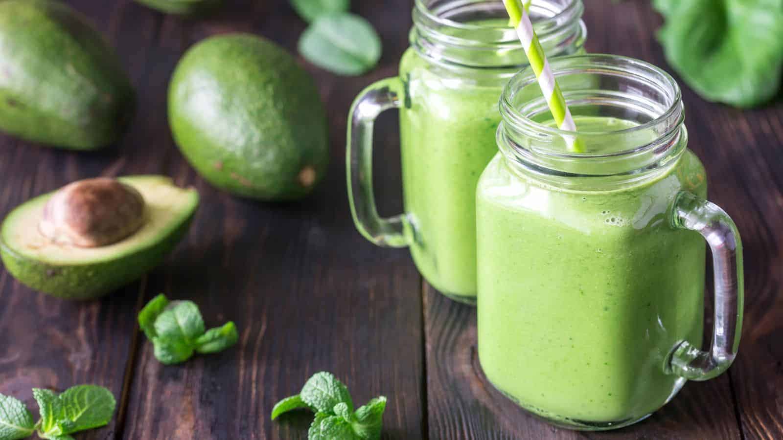 Dairy-free Keto Green Smoothie in two glasses with ingredients around.