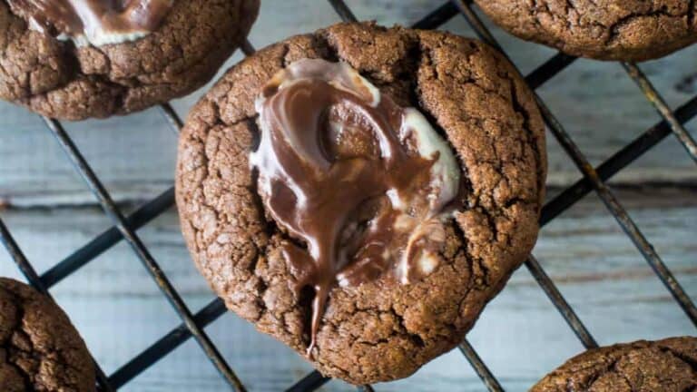 Chocolate cookies on a cooling rack.