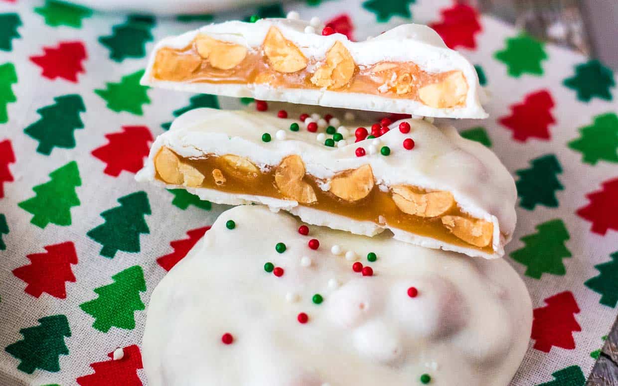 A stack of white chocolate peanut butter candy with sprinkles on top.