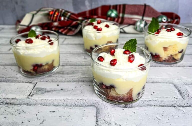 White chocolate pomegranate trifle in mini glasses.