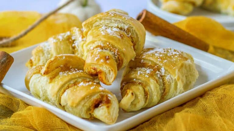 Cinnamon sugar croissants on a white plate.