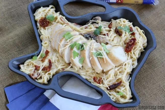 Pasta in a Texas shaped cast iron skillet.