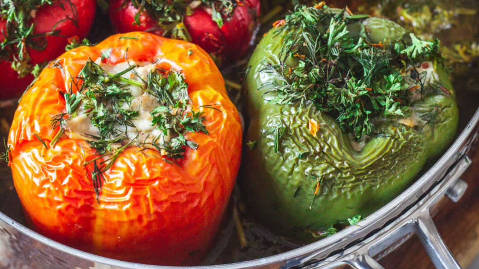 Stuffed peppers with herbs in a pan.